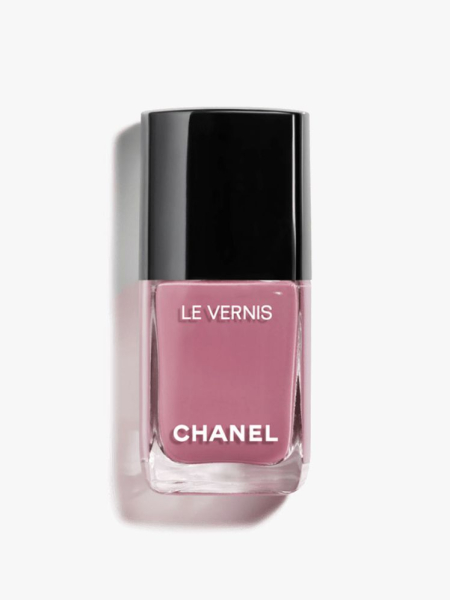 A bottle of Chanel Le Vernis Longwear Nail Color in Sorcière on a light gray background