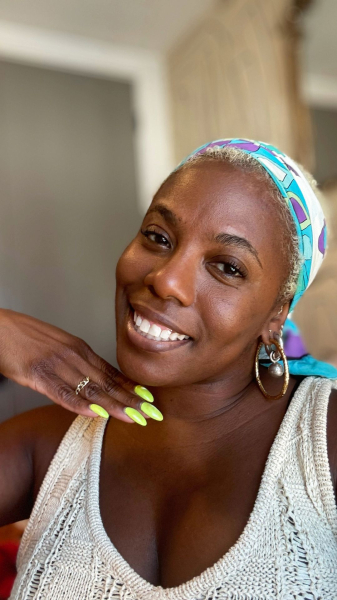 Image may contain Head Person Face Accessories Jewelry Ring Body Part Neck Happy Smile Dimples and Shoulder
