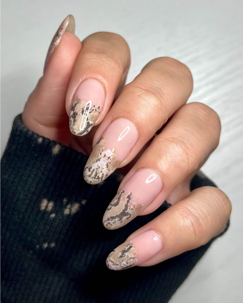 Realistic snake skin overline French tip design.